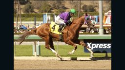Jockey Victor Espinoza, seeking win the Triple Crown with California Chrome, rides the horse during the San Felipe Stakes at Santa Anita in March.
