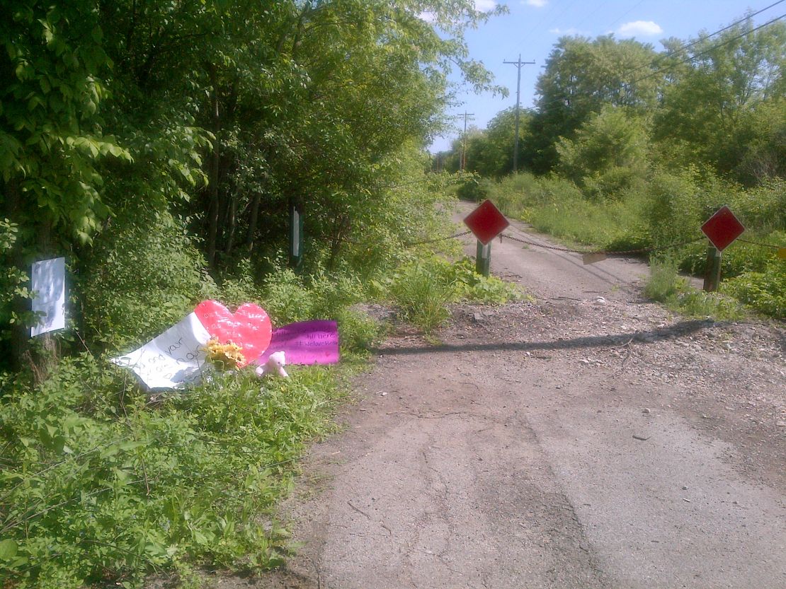 Cards and a stuffed animal have been placed at the site where the 12-year-old was found after the stabbing. 