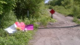 Cards and a stuffed animal have been placed at the site where the 12-year-old was found after the stabbing.