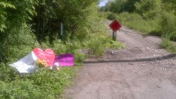 Cards and a stuffed animal have been placed at the site where the 12-year-old was found after the stabbing.