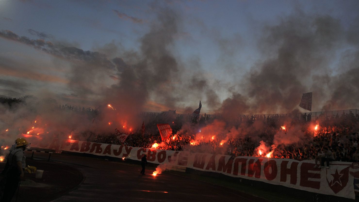 Fans of Red Star Belgrade light flares in support of their team but could they miss out on the 2014/15 Champions League?