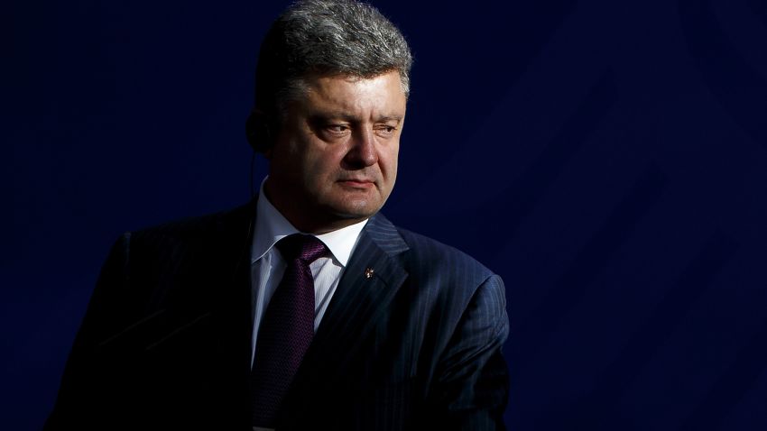 Recently-elected Ukrainian President Petro Poroshenko and German Chancellor Angela Merkel (not pictured) give statements to the media prior to talks at the Chancellery on June 5, 2015 in Berlin, Germany.