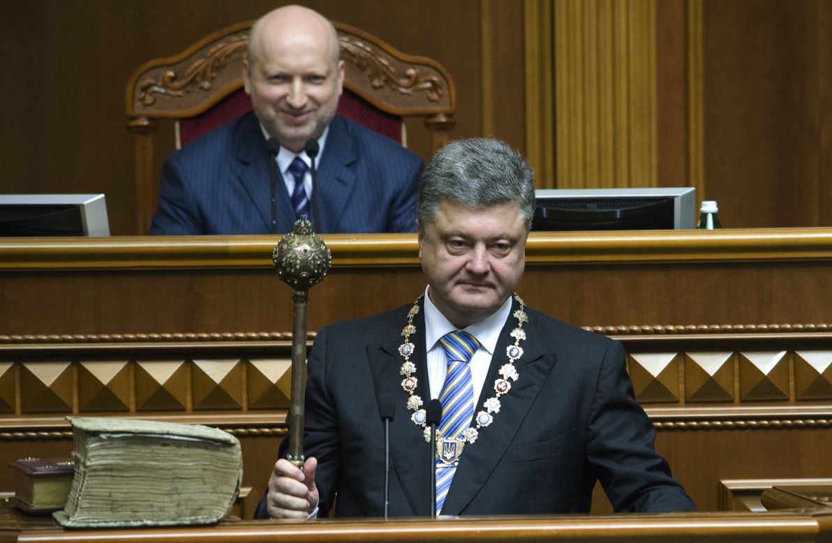 Poroshenko holds the ceremonial mace during his inauguration ceremony Saturday, June 7, in Kiev. Poroshenko was elected three months after the ouster of former President Viktor Yanukovych.