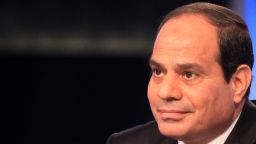 Egypt's ex-army chief and leading presidential candidate Abdel Fattah al-Sisi gives his first television interview since announcing his candidacy in Cairo on May 4, 2014. Sisi is expected to win the May 26-27 election easily riding on a wave of popularity after he ousted in July Mohamed Morsi, Egypt's first freely elected president. The 59-year-old retired field marshal, dressed in a suit and appearing composed and often smiling in what was a pre-recorded interview, is seen by supporters as a strong leader who can restore stability, but his opponents fear that might come at the cost of freedoms sought in the pro-democracy uprising three years ago. AFP PHOTO/STR        (Photo credit should read