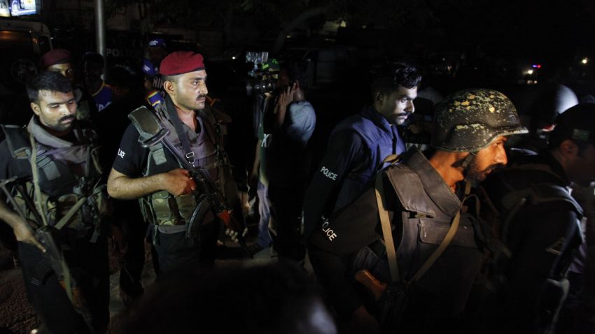Pakistani commandos get ready to enter Karachi airport terminal following attacks by unknown gunmen on Sunday night, June 8.