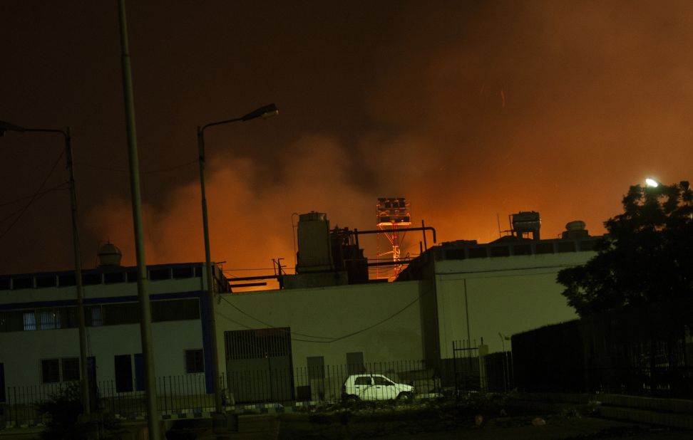 Fire illuminates the sky above a terminal at the  airport, Pakistan's largest and busiest, on June 8. 