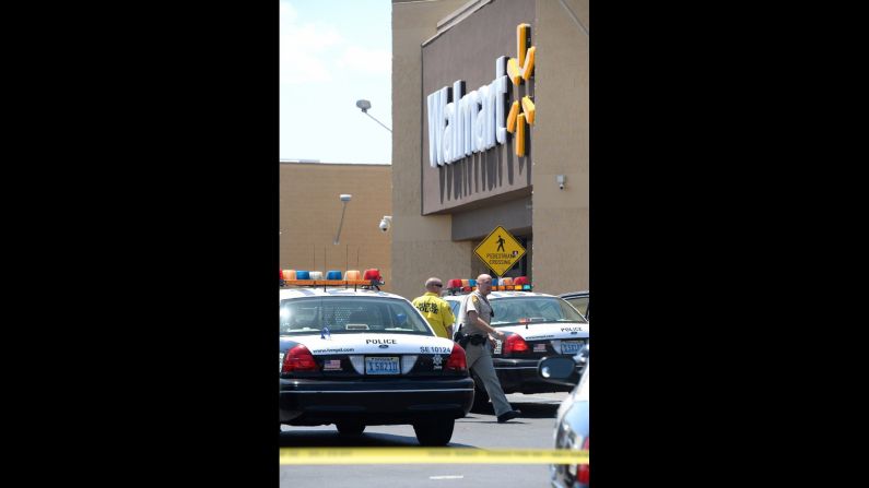 Police cars and personnel gather at the scene.