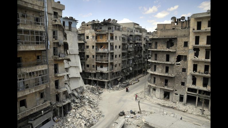 Apartments and other buildings lie in ruins on Tuesday, June 3, in <a href="index.php?page=&url=http%3A%2F%2Fwww.cnn.com%2F2014%2F06%2F09%2Fworld%2Fmeast%2Fsyria-aleppo-reporters-notebook%2F">Aleppo, a city that "has had the life bombed out of it,"</a> according to CNN's Nick Paton Walsh.