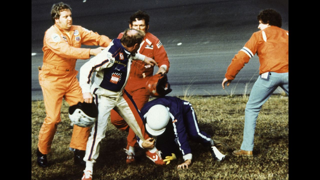 <strong>Cale Yarborough and Donnie Allison: </strong>NASCAR lists it as its top post-race scuffle. After some back-and-forth bumping between Yarborough, second left, and Allison, third left, led the pair to hit the wall and slide into the infield on the final lap of the 1979 Daytona 500, the two exited their cars to argue. When Allison's brother, Bobby, second right, joined the fray, a helmet was swung before a nationally televised brawl broke out. 