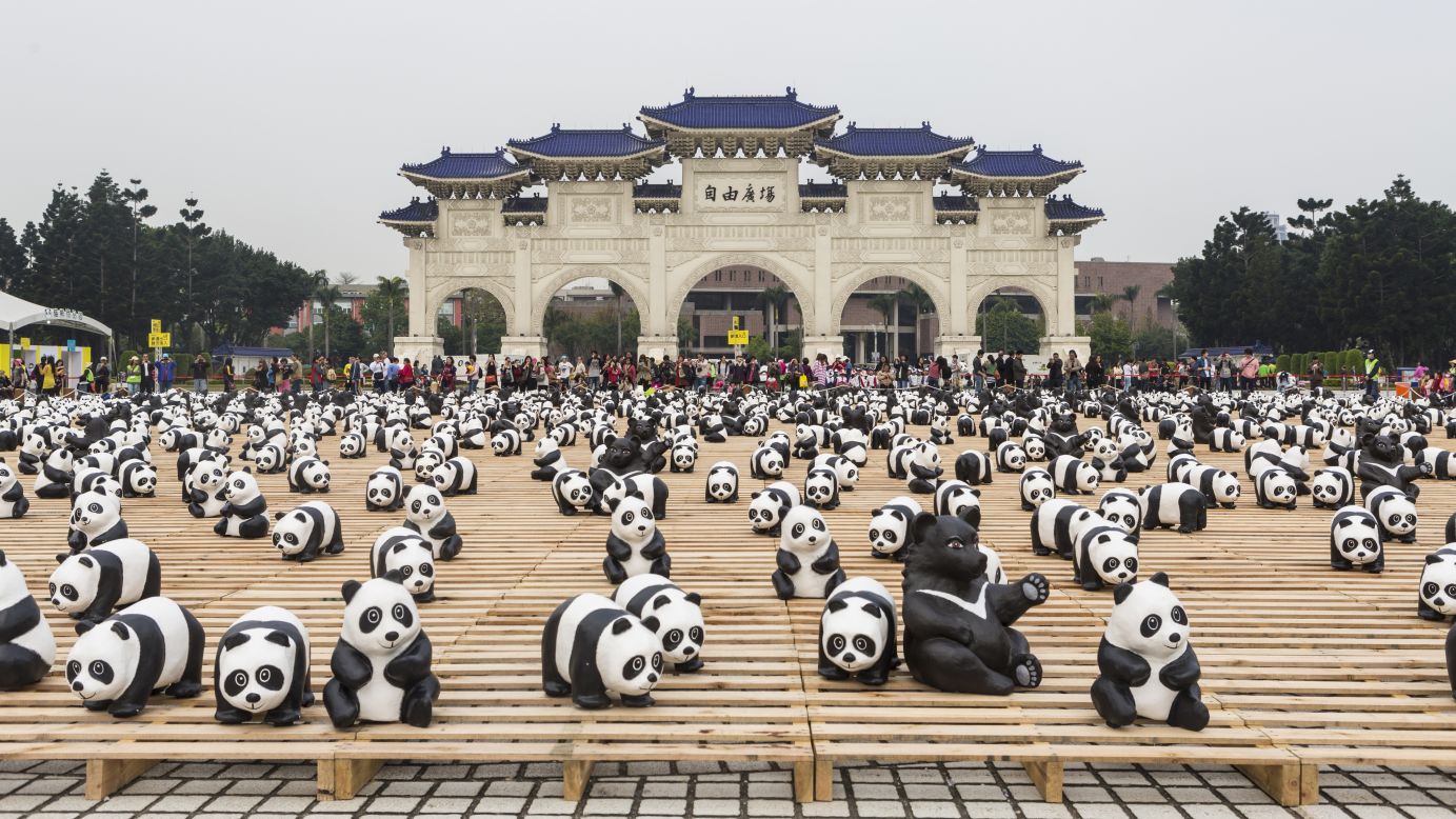 In March, the pandas visit the main gate at the Chiang Kai-shek Memorial Hall in Taipei, Taiwan. Grangeon also created 200 endangered Formosan black bears to join the pandas for the Taipei leg of the tour. 