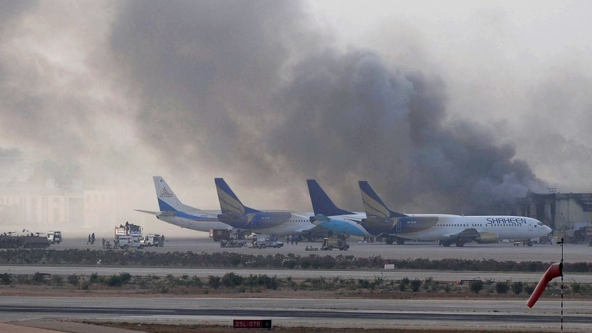 Smoke rises after militants launched an early morning assault at Jinnah International Airport in Karachi on June 9, 2014. Pakistan's security forces said on June 9 they have relaunched a military operation at Karachi airport as gunfire resumed several hours after they announced the end of a militant siege that left 24 dead. AFP PHOTO / Rizwan TABASSUM (Photo credit should read RIZWAN TABASSUM/AFP/Getty Images)