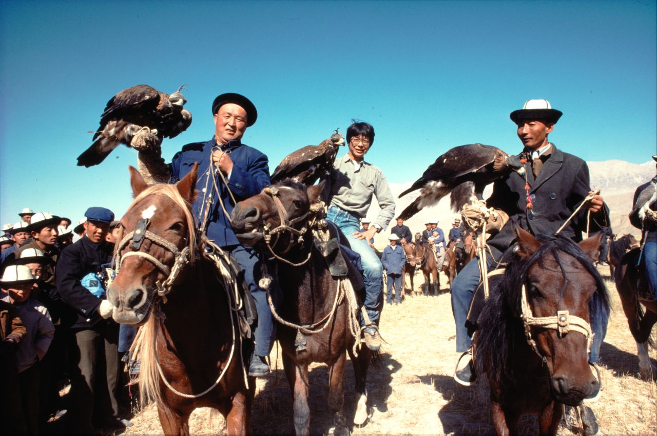 Wong How Man, center, in 1984 with Kirghiz eagle hunters at the border between China's Xinjiang province and the former Soviet Union. A year later, he led an expedition to find the source of the Yangtze River that required him and his team to travel nine days on horseback. 