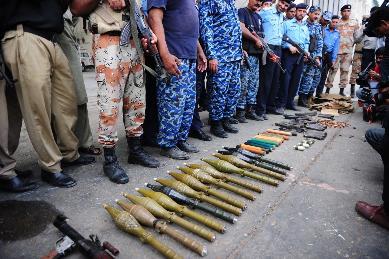 Pakistani police display weapons seized from militants in the attack on June 9. 