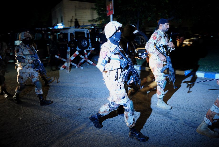 Pakistani security personnel arrive at the site of the airport attack on June 8.