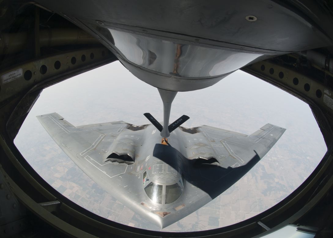A KC-135 Stratotanker refuels a B-2 during a training mission in August 2012. The B-2 is powered by four General Electric F118-GE-100 engines, and it can travel 6,000 miles without refueling.