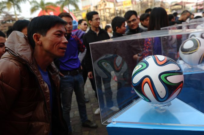 The Brazuca has already been in the limelight as the support act on the World Cup Trophy Tour. Here fans in the Vietnamese capital of Hanoi take a close look at the official ball. 