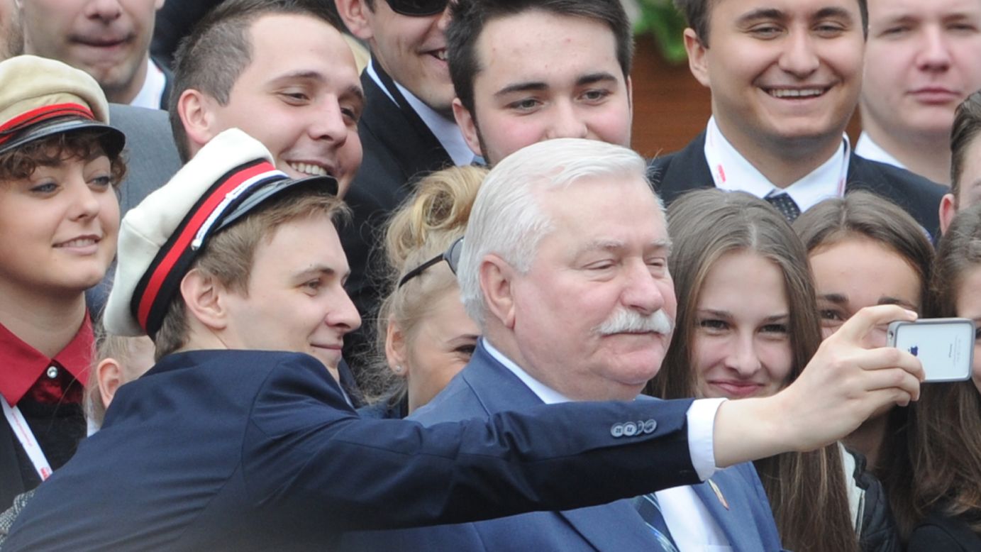 Former Polish President Lech Walesa has his photo taken with well-wishers in Warsaw, Poland, on Wednesday, June 4. Walesa was attending a ceremony that marked the 25th anniversary of Poland's return to democracy. U.S. President Barack Obama also attended the ceremony during his <a href="http://www.cnn.com/2014/06/03/politics/gallery/obama-europe-june/index.html">recent trip to Europe</a>.