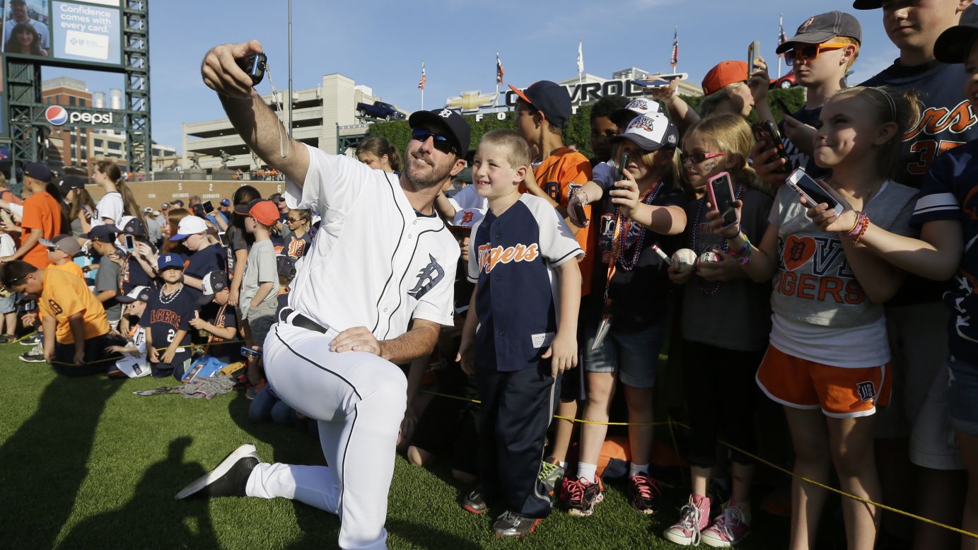 Detroit Tigers pitcher Justin Verlander takes a selfie with a group of children Sunday, June 8, before a home baseball game against the Boston Red Sox.