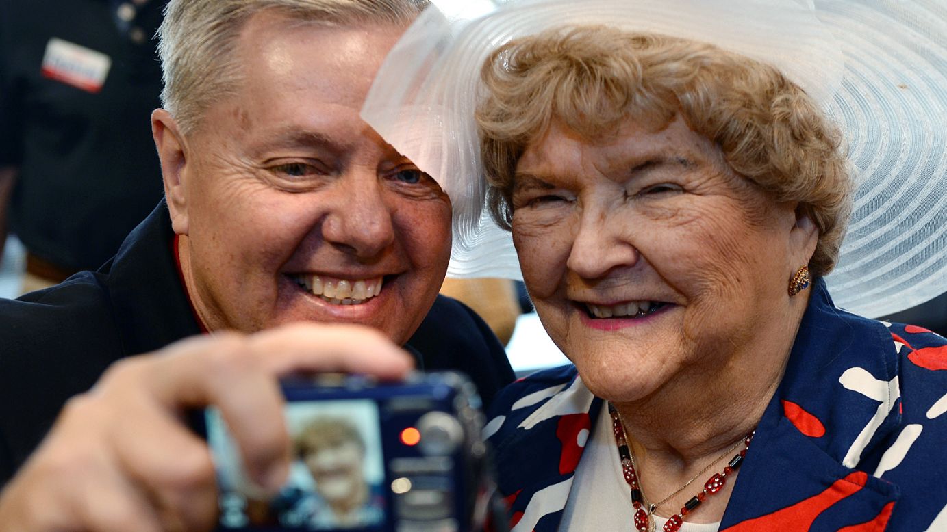 U.S. Sen. Lindsey Graham takes a selfie with MaryAnn Riley following a campaign stop at the YMCA in Spartanburg, South Carolina, on Monday, June 9.