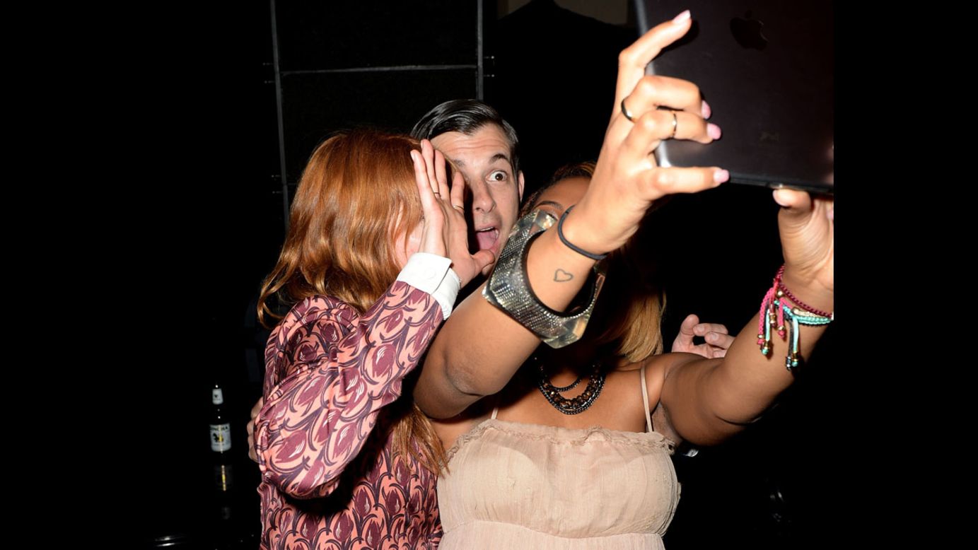 Singer Florence Welch, left, and musician Mark Ronson appear in a selfie Wednesday, June 4, as they attend The Other Ball in London for the charity Arms Around the Child.