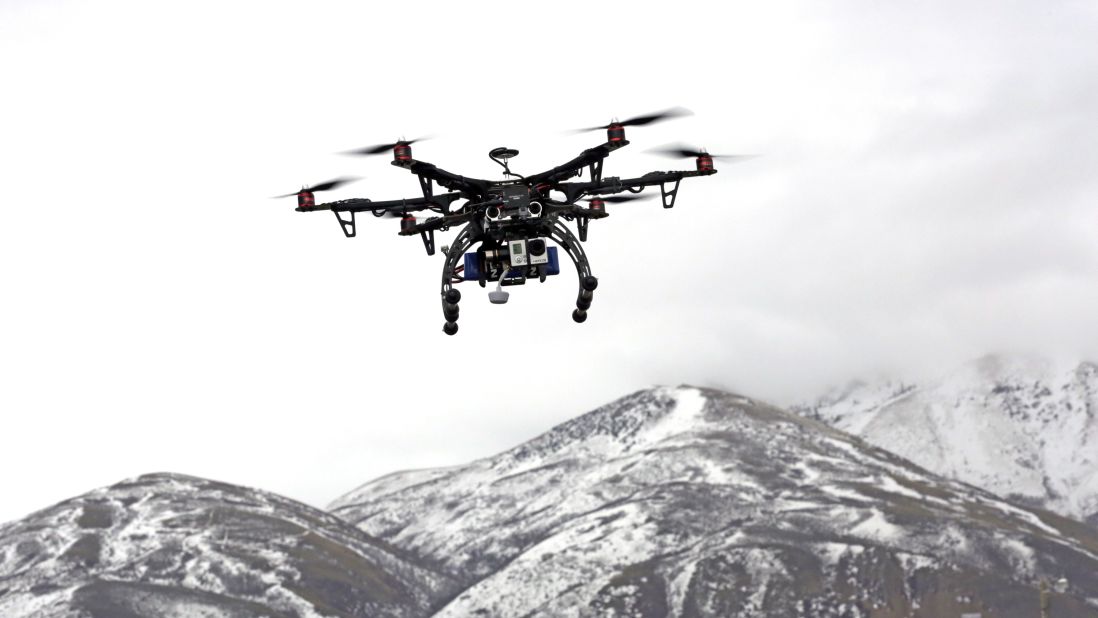 Members of the Box Elder County Sheriff's Office fly their search-and-rescue drone during a demonstration in Brigham City, Utah, on February 13, 2014. Gov. Gary Hebert has approved the state's first drone restrictions, setting new limits on law enforcement's use of the technology. 
