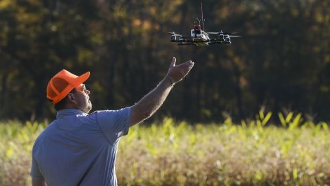 A drone designed to capture footage of illegal hunting activities lands after taking footage at Erwin Wilder Wildlife Management Area in Norton, Massachusetts, on October 21, 2013.
