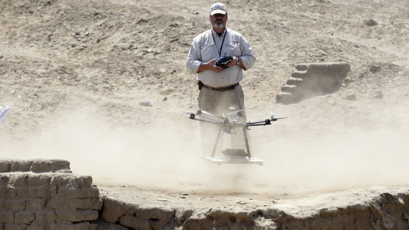 Luis Jaime Castillo, a Peruvian archaeologist, uses a drone to take pictures of the archaeological site of San Jose de Moro in Trujillo on July 18, 2013. In Peru, home to Machu Picchu and thousands of ancient ruins, archaeologists are turning to drones to speed up sluggish survey work and protect sites from squatters, builders and miners.