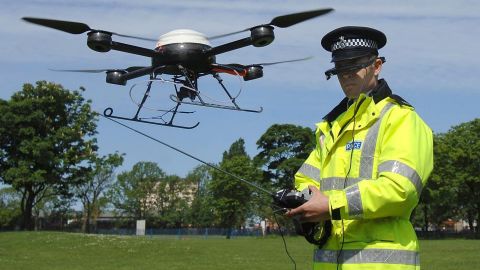 Derek Charlton of the Merseyside Police operates the department's new aerial surveillance drone in Liverpool, England, on May 21, 2007.