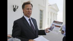 Seventh District US Congressional Republican candidate, David Brat displays an immigration mailer by Congressman Eric Cantor during a press conference at the Capitol in Richmond, Va., Wednesday, May 28, 2014. Brat challenged Congressman Eric Cantor's stand on immigration, claiming that Cantor backs amnesty. Cantor is getting pressured from both sides over immigration as his Republican primary election nears and the window for legislative action narrows.   (AP Photo/)