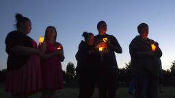 TROUTDALE, OR - JUNE 10:   Friends, family and well-wishers hold candles for Emilio Hoffman, the victim of today's school shooting at a vigil on  June 10, 2014 in Troutdale, Oregon. A gunman walked into Reynolds High School  with a rifle and shot 14 year old Hoffman to death on Tuesday, in what is the the third outbreak of gun violence in a U.S. school in less than three weeks. (Photo by Natalie Behring/Getty Images)