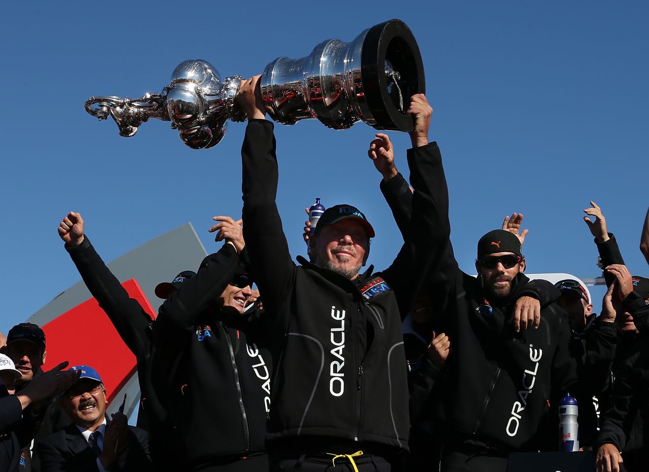 Larry Ellison holds the coveted Cup aloft after defeating Emirates Team New Zealand in a thrilling comeback last year.