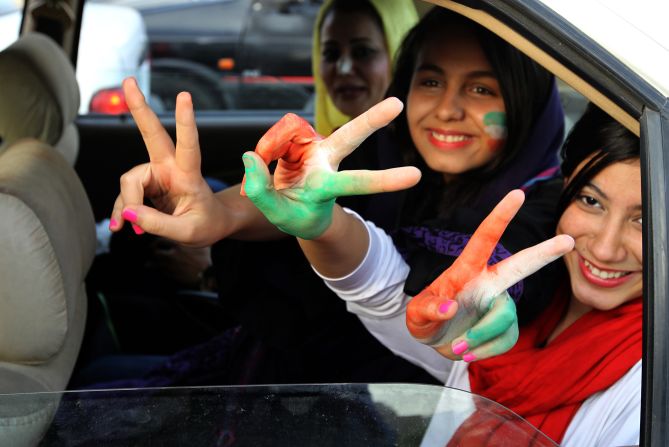 Fans celebrate in northern Tehran after Iran won their 2014 World Cup Asian zone group A qualifying football match against South Korea to qualify for the World Cup.