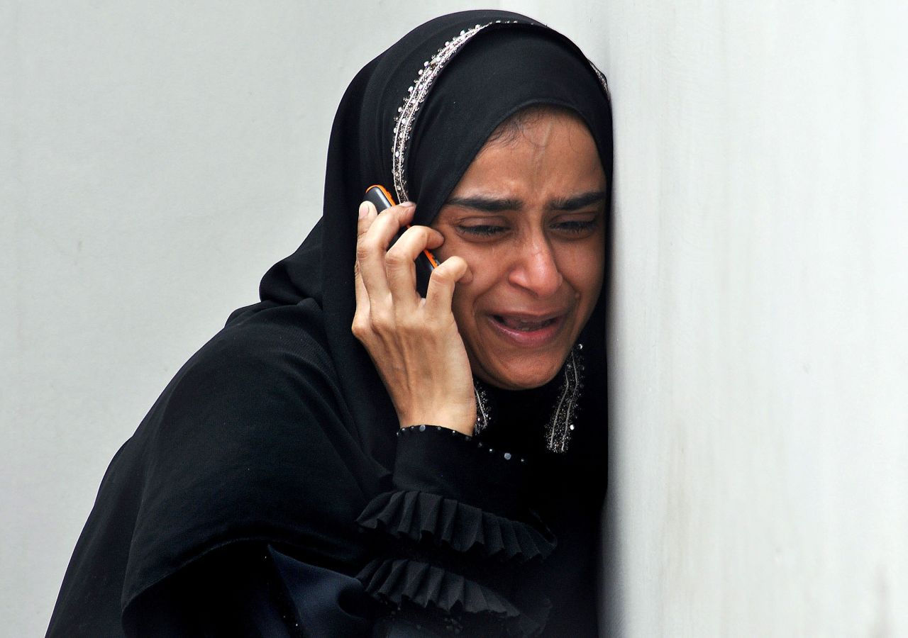 A woman weeps upon receiving news that a relative was killed in an attack on Jinnah International Airport in Karachi, Pakistan. Militants launched the first attack in the cargo area of the airport on June 8, leaving at least 36 people dead, including 10 militants, then struck again on June 10, targeting the Airport Security Forces academy near the airport. The Pakistani Taliban claimed responsibility for both attacks.