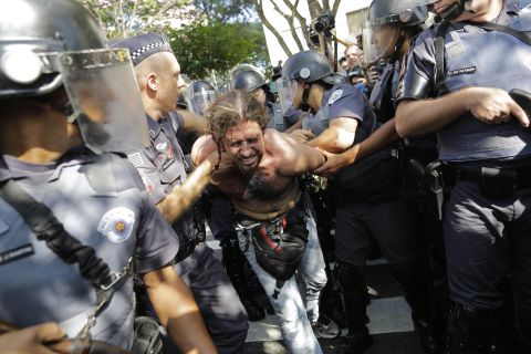 Another protester is detained by police June 12 in Sao Paulo.