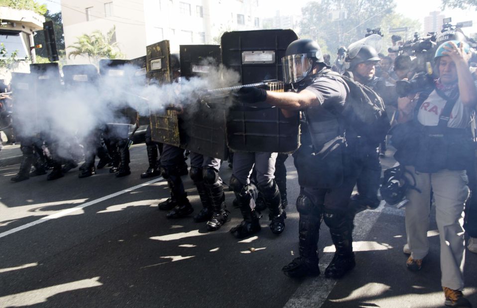 Police fire rubber bullets at protesters in Sao Paulo.