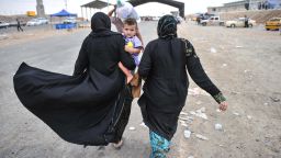 Civilians escape from Mosul to a camp managed by United Nations and the  Kurd government near Erbil, Iraq on Thursday, June 12.