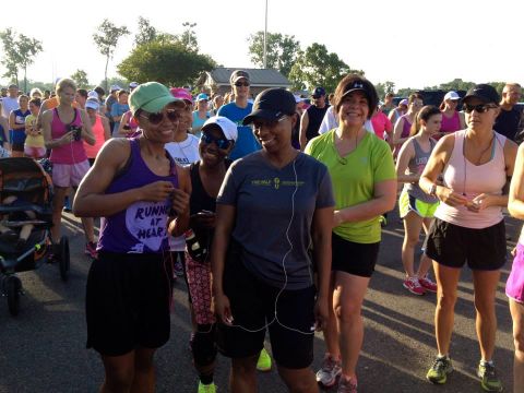 Evans, left, says somewhere along her journey, she "fell in love with running." Here, she participates in the Red River Road Runners Summer Fun Run on June 5, weighing 125 pounds. 