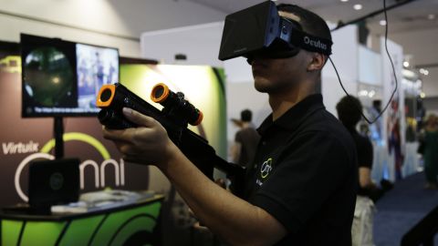 An attendee tries out the Virtuix Oculus Rift setup this month at the Electronic Entertainment Expo in Los Angeles.