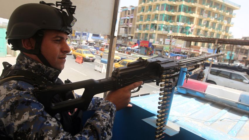 An Iraqi policeman mans a checkpoint in the capital Baghdad on June 12, 2014, as jihadists and anti-government fighters have spearheaded a major offensive that overrun all of Nineveh province.