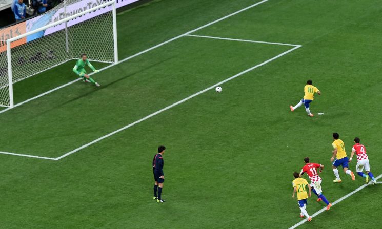 Neymar scores a penalty kick to give Brazil a 2-1 lead. It was Neymar's second goal of the match, which was played in Sao Paulo, Brazil.