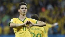 Brazil's midfielder Oscar celebrates after scoring a goal