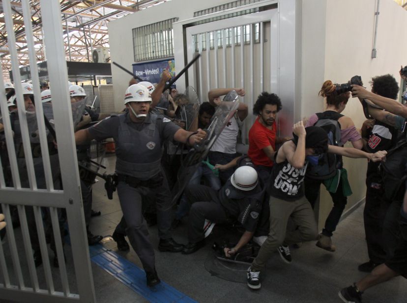 Protesters clash with police in Tatuape subway station, east of Sao Paulo, Brazil, on June 12.