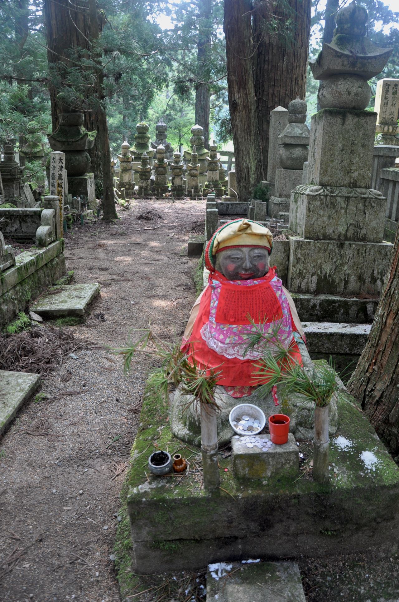 This adorable Okunoin cemetery statue is wearing makeup. People in need of some beauty come to it to make offerings. 