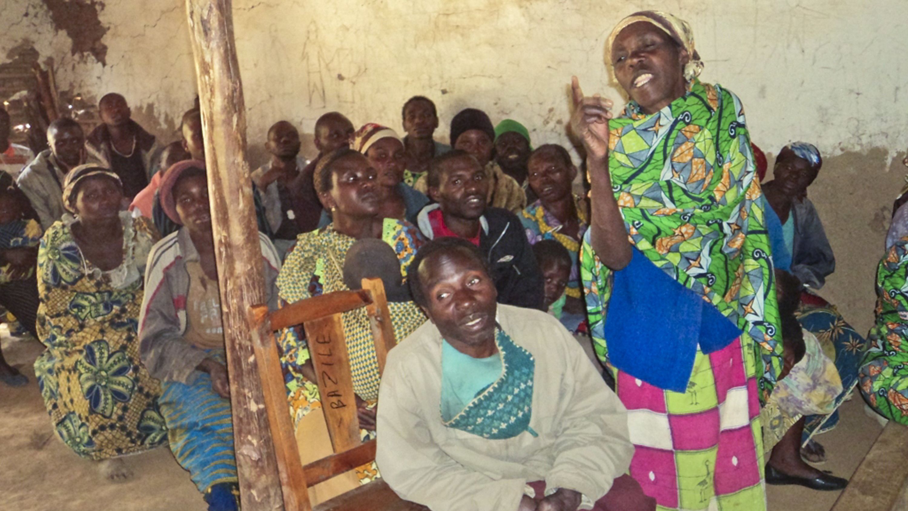 Katungu Mwirawivu offers her opinion in a communal assembly. The 50-year-old mother of 10  lives in Virenge, a village in the Democratic Republic of Congo where CARE worker Michael Alandu trains community members in gender sensitization and equality. 
