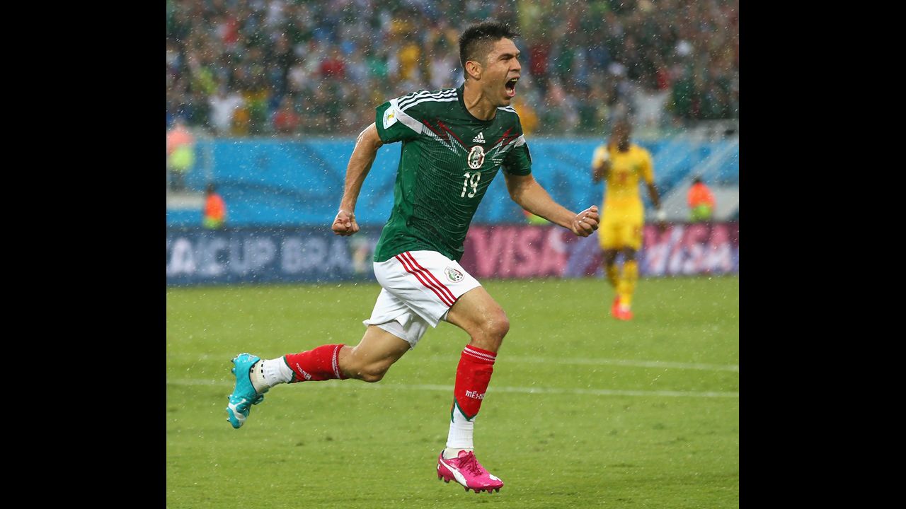 Oribe Peralta celebrates after scoring the only goal in Mexico's 1-0 win over Cameroon on June 13 in Natal, Brazil.