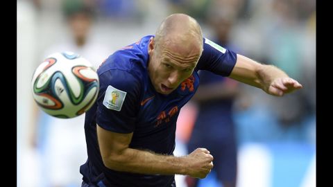 Robben heads the ball in the first half.