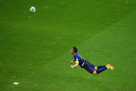 Van Persie scores a diving header in the first half of the match against Spain. It tied the score at 1-1.