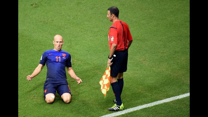 Robben slides on the ground after scoring his first goal. It gave the Dutch a 2-1 lead in the second half.