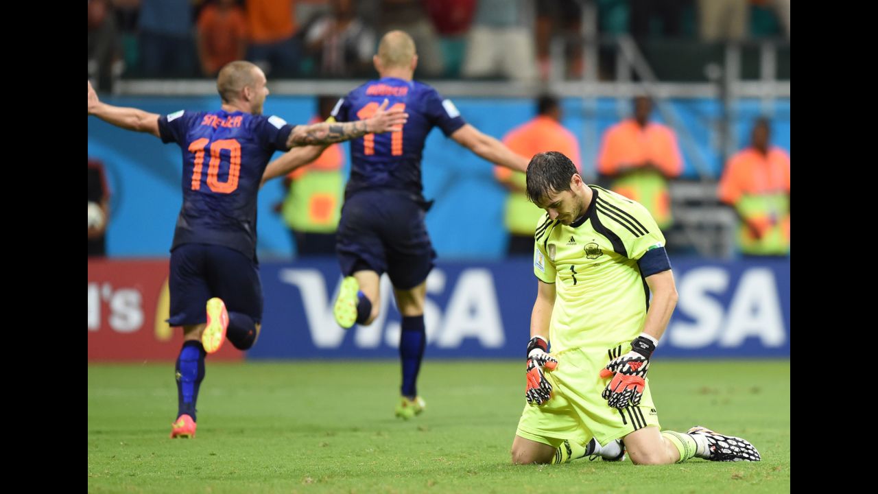 Spanish goalkeeper Iker Casillas, right, reacts after Dutch forward Arjen Robben, center, scored to put the finishing touches on a 5-1 win for the Netherlands on June 13. It was Robben's second goal of the match, which was played in Salvador, Brazil.