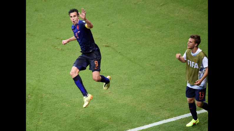 Netherlands forward Robin van Persie, left, celebrates after scoring his second goal of the match to put the Dutch up 4-1.